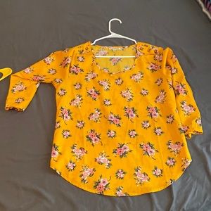 I’m selling a shirt . The colors are yellow , pinky, light green